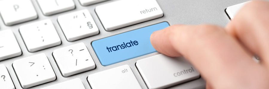 Concept for machine translation - user pushing a "translate" button on a keyboard